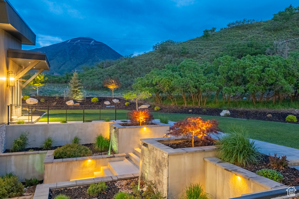 View of yard with a fire pit and a mountain view