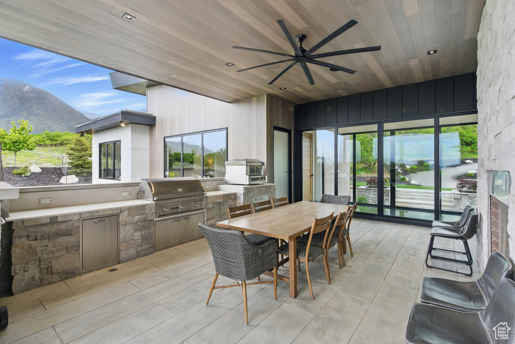 Sunroom with a mountain view and plenty of natural light