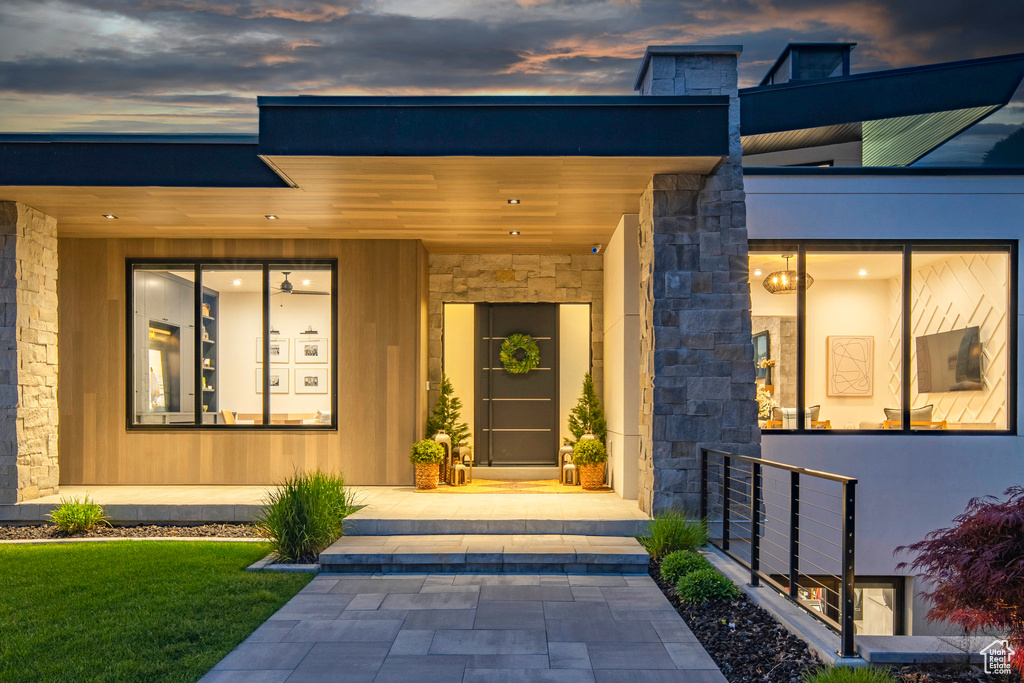 Doorway to property with stone siding