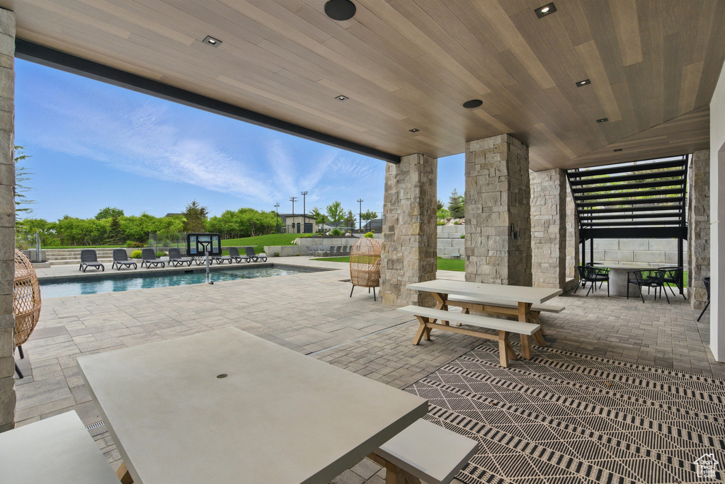 View of patio / terrace featuring outdoor dining space and fence