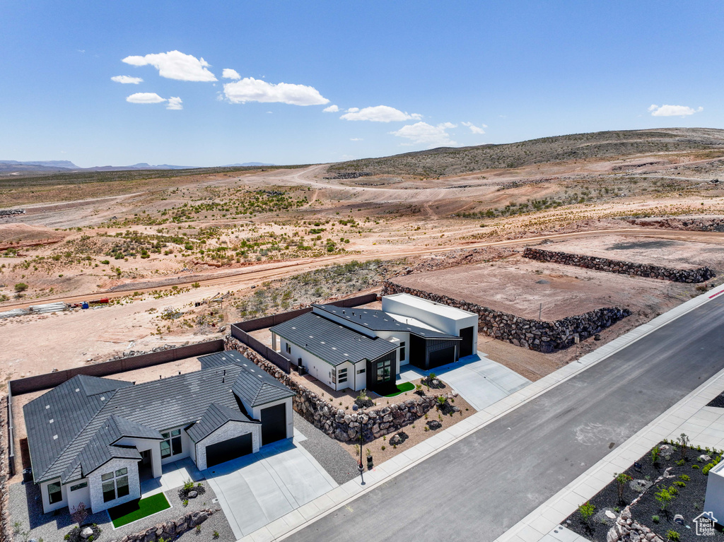 Overview of rural landscape with a desert landscape and a mountainous background