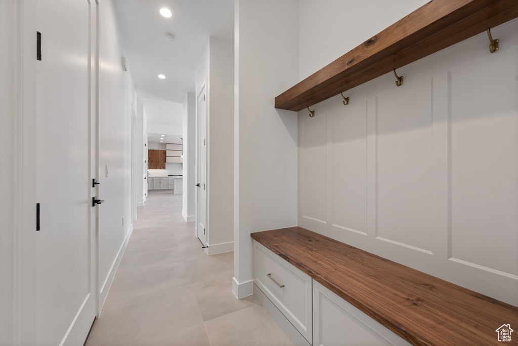 Mudroom with recessed lighting and baseboards