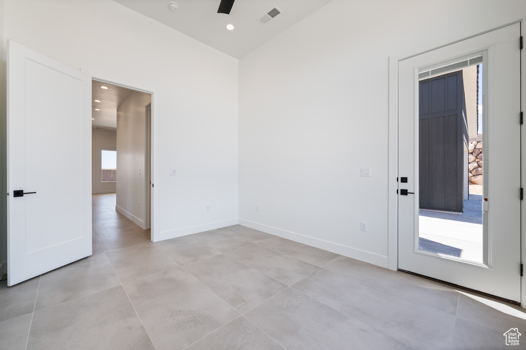 Spare room featuring ceiling fan, baseboards, and recessed lighting