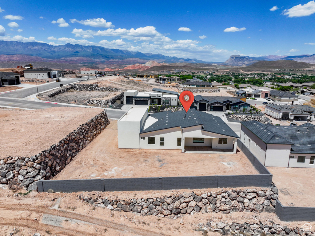 Aerial perspective of suburban area with a mountain backdrop