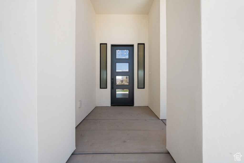 Doorway to property with stucco siding