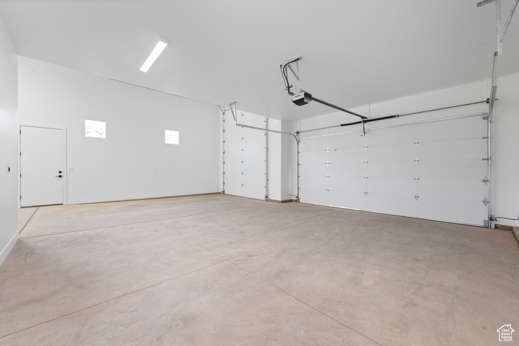 Garage featuring a garage door opener