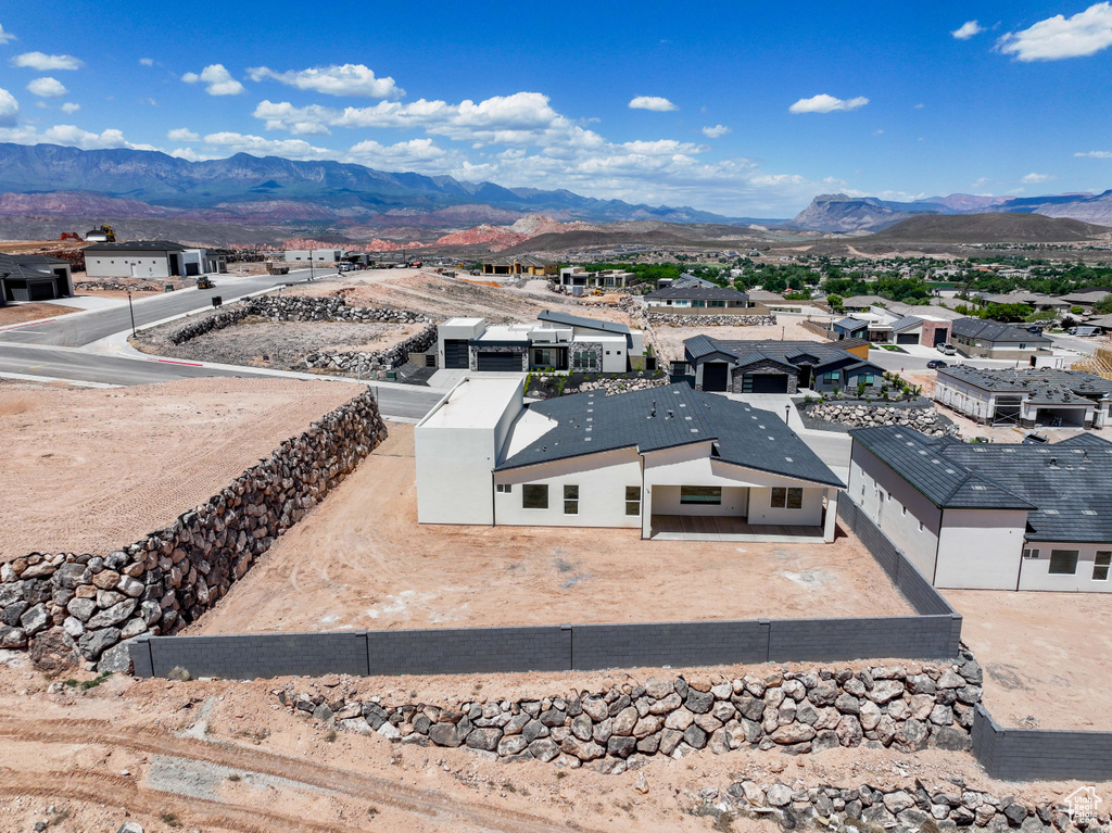 Aerial view of residential area with mountains