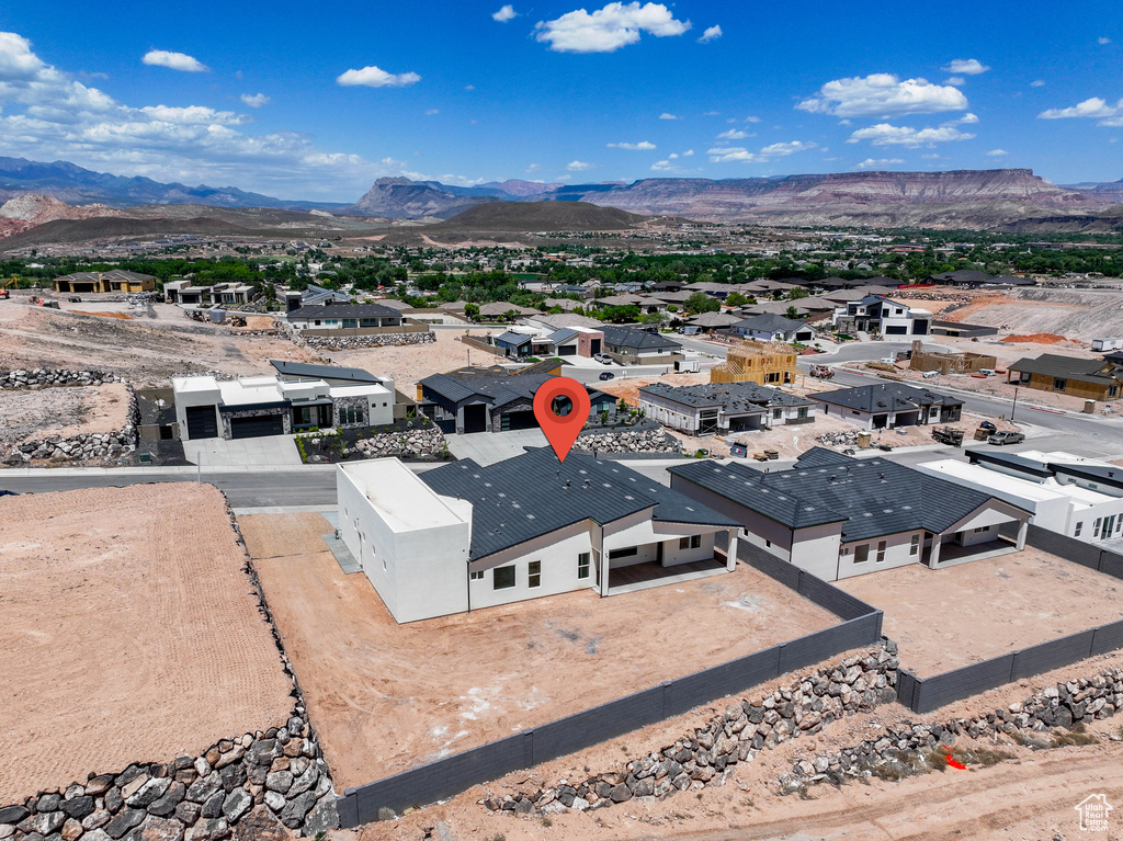 Aerial view of residential area with a mountain backdrop