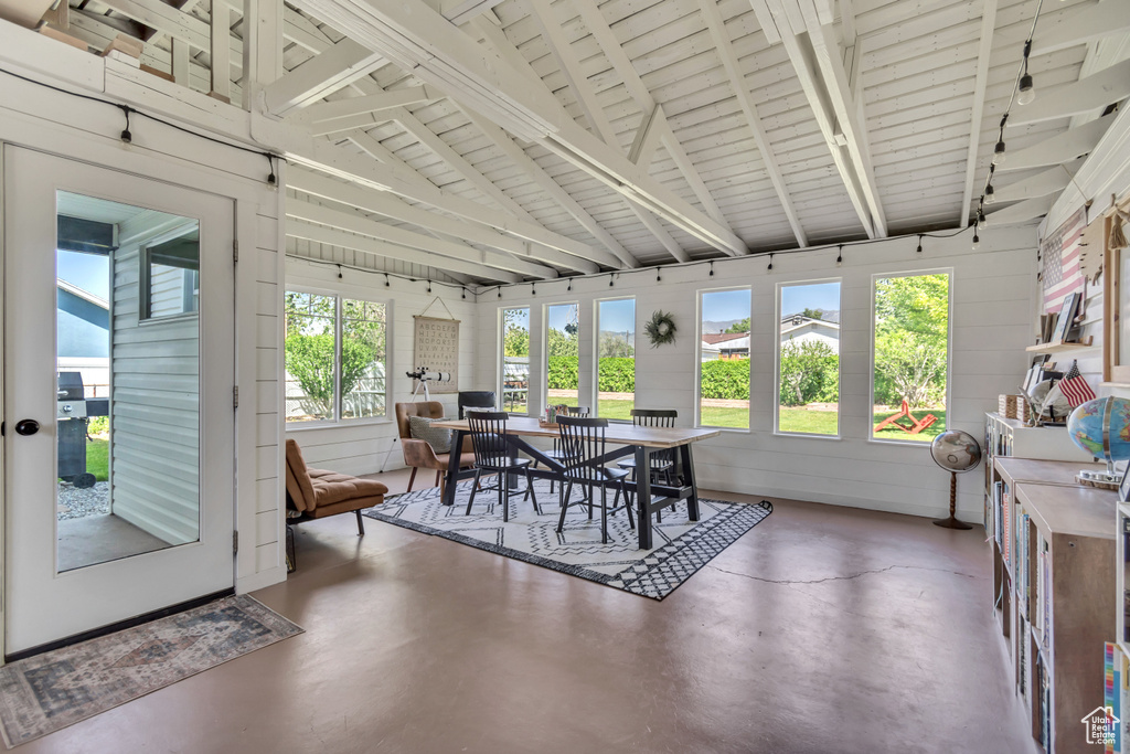 Sunroom featuring lofted ceiling