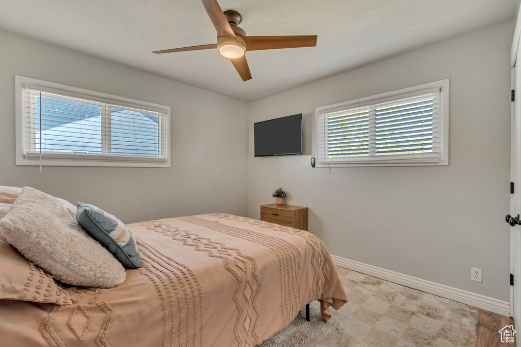 Bedroom with baseboards and a ceiling fan
