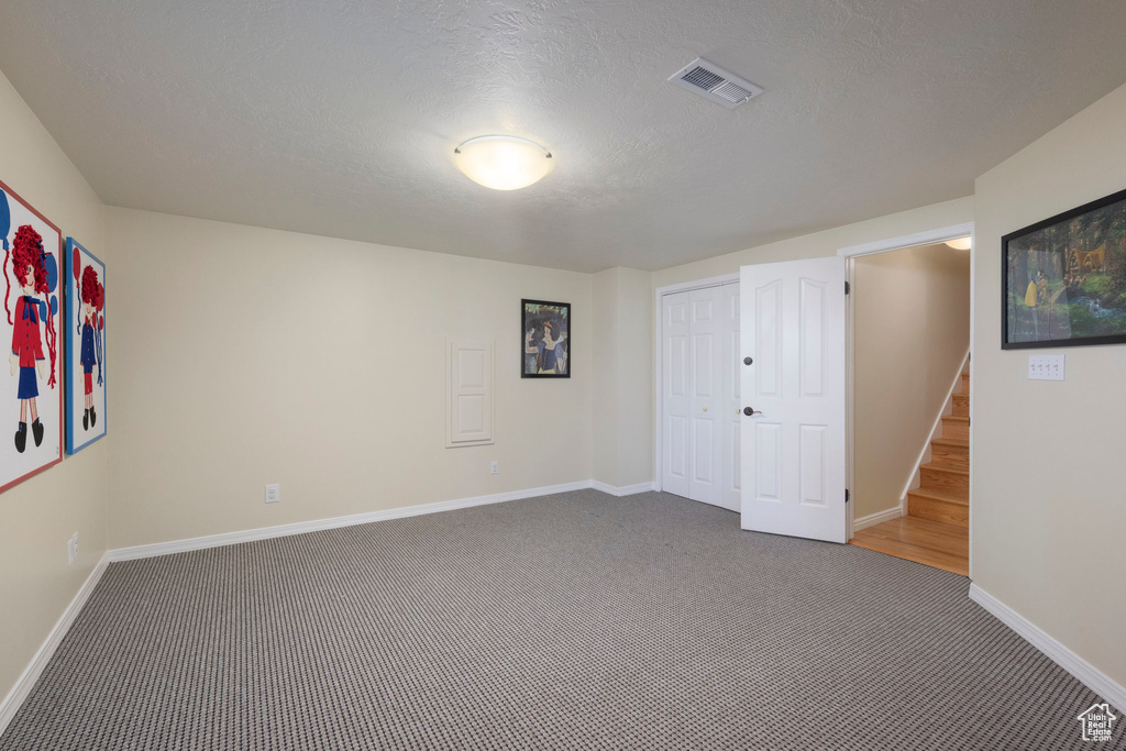 Spare room with carpet floors and baseboards