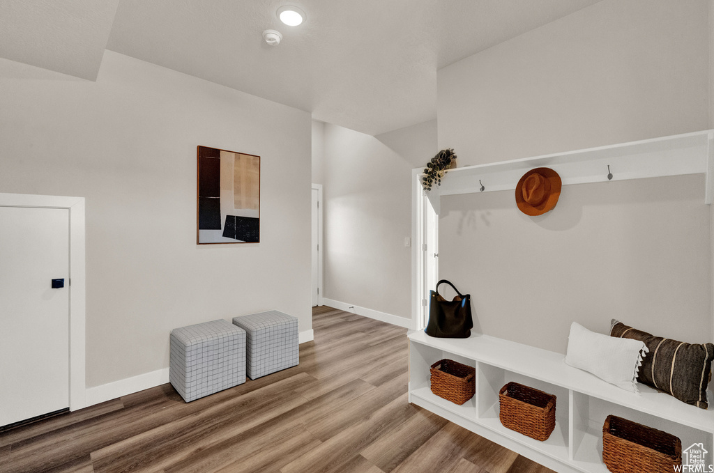 Mudroom with light wood-type flooring and baseboards