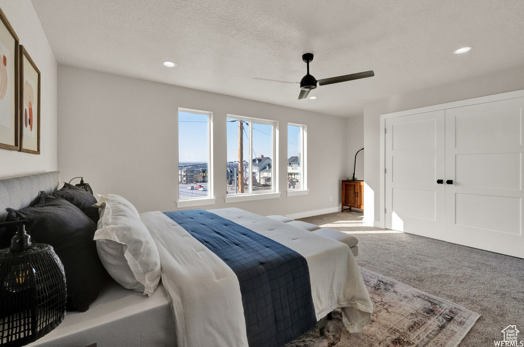 Bedroom featuring carpet, recessed lighting, ceiling fan, and baseboards