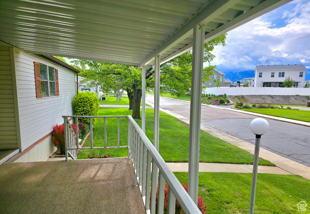 Balcony featuring a porch and a residential view