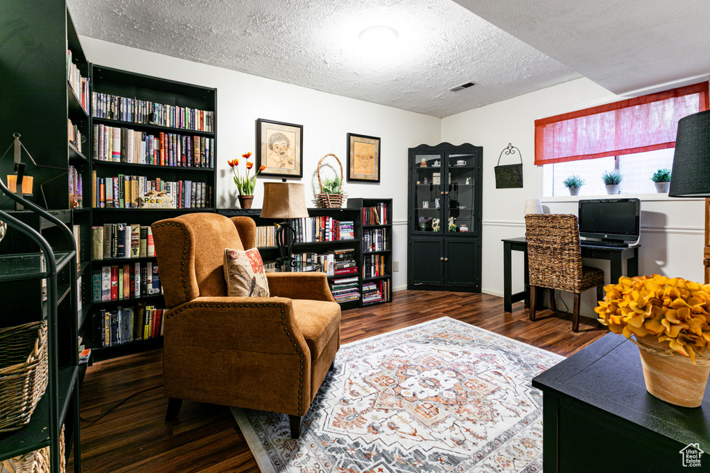 Office featuring a textured ceiling and wood finished floors