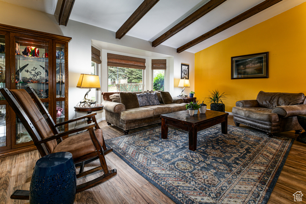 Living area featuring wood finished floors and baseboards