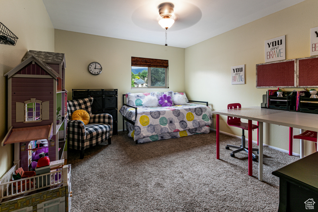 Carpeted bedroom with baseboards