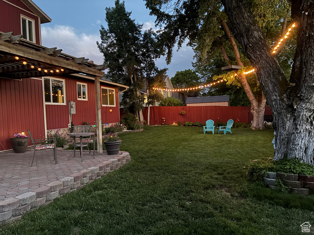 View of yard featuring a pergola and a patio area