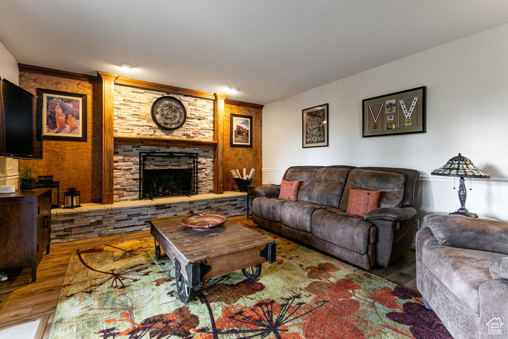 Living room featuring wood finished floors and a fireplace
