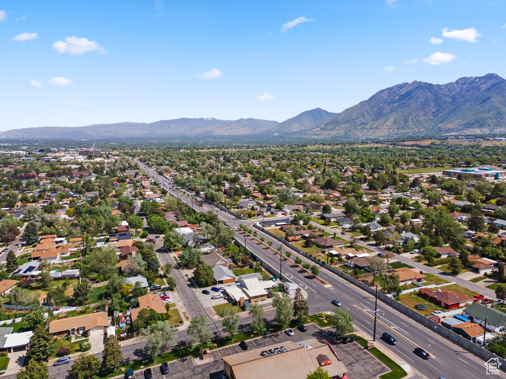 Aerial perspective of suburban area with a mountain backdrop