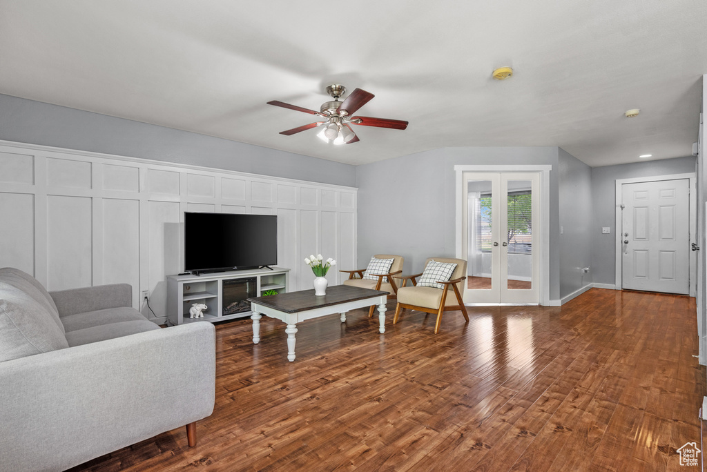Living area featuring wood finished floors, ceiling fan, french doors, baseboards, and recessed lighting