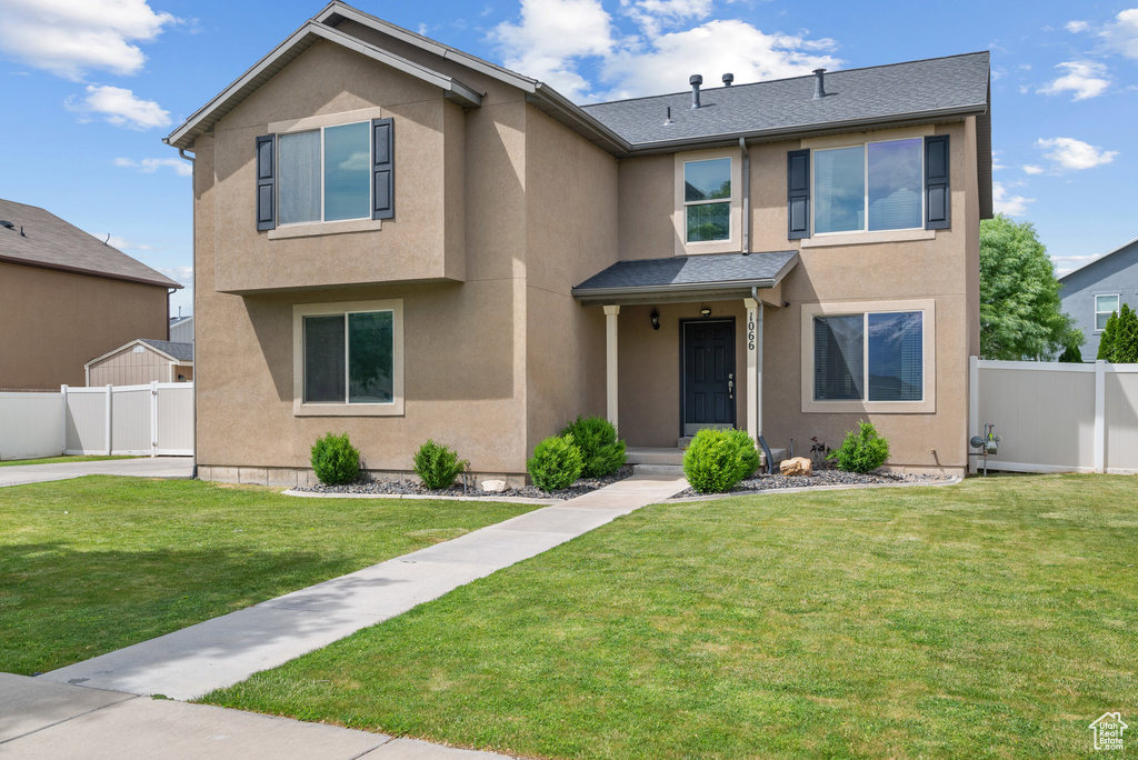View of front of house featuring stucco siding