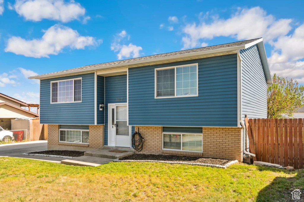 Split foyer home with brick siding
