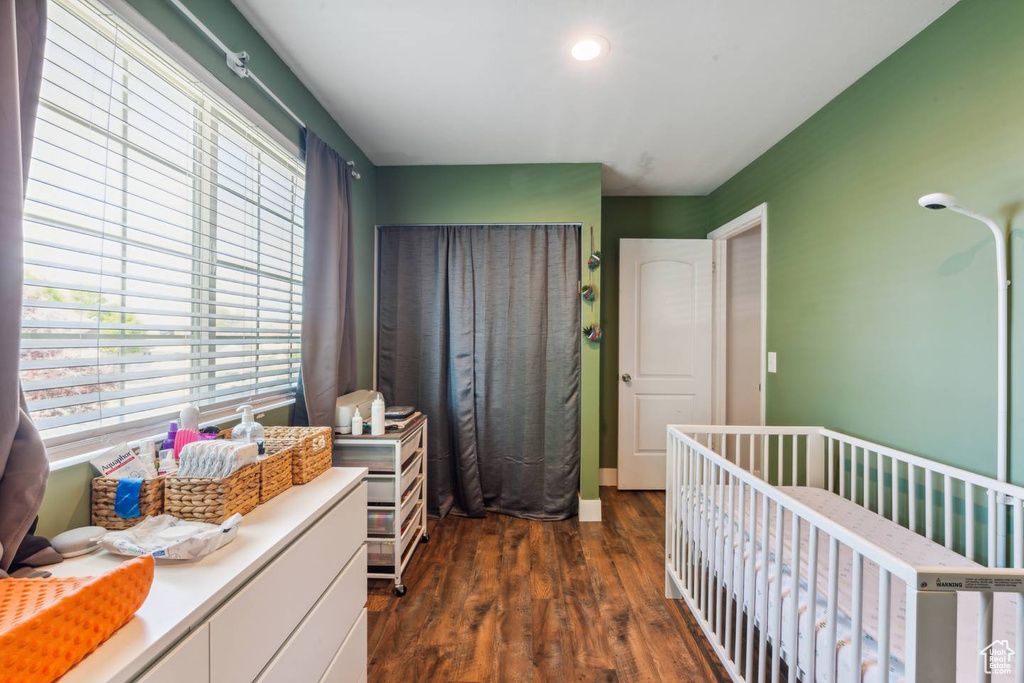 Bedroom featuring dark wood-style floors and recessed lighting