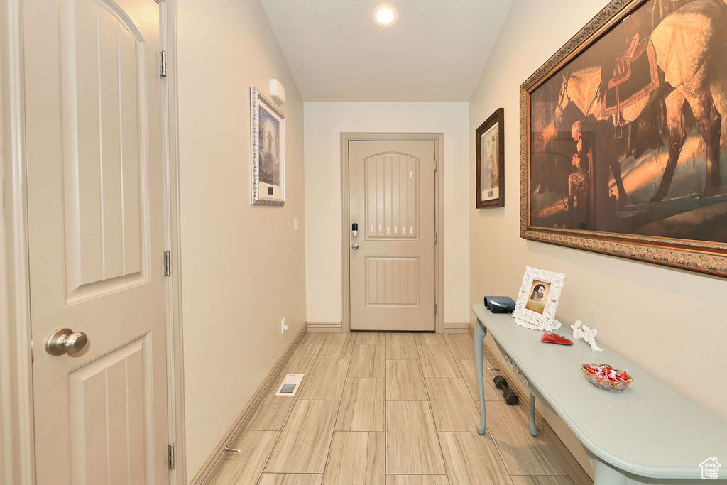 Doorway to outside with baseboards