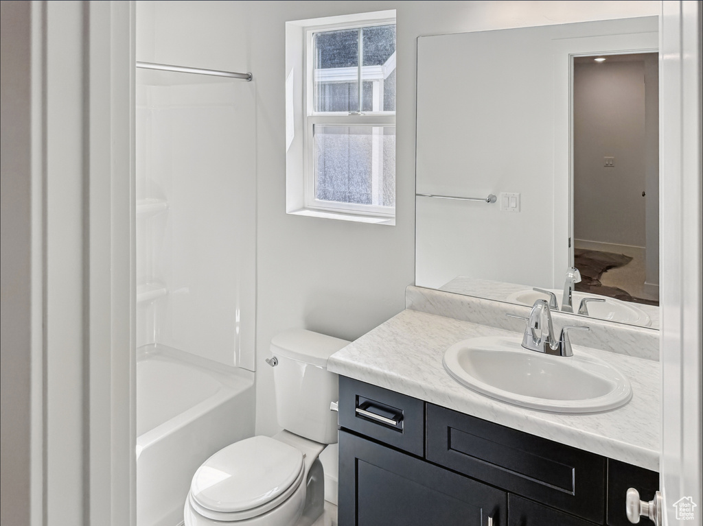 Full bathroom with vanity, toilet, and shower / bathtub combination