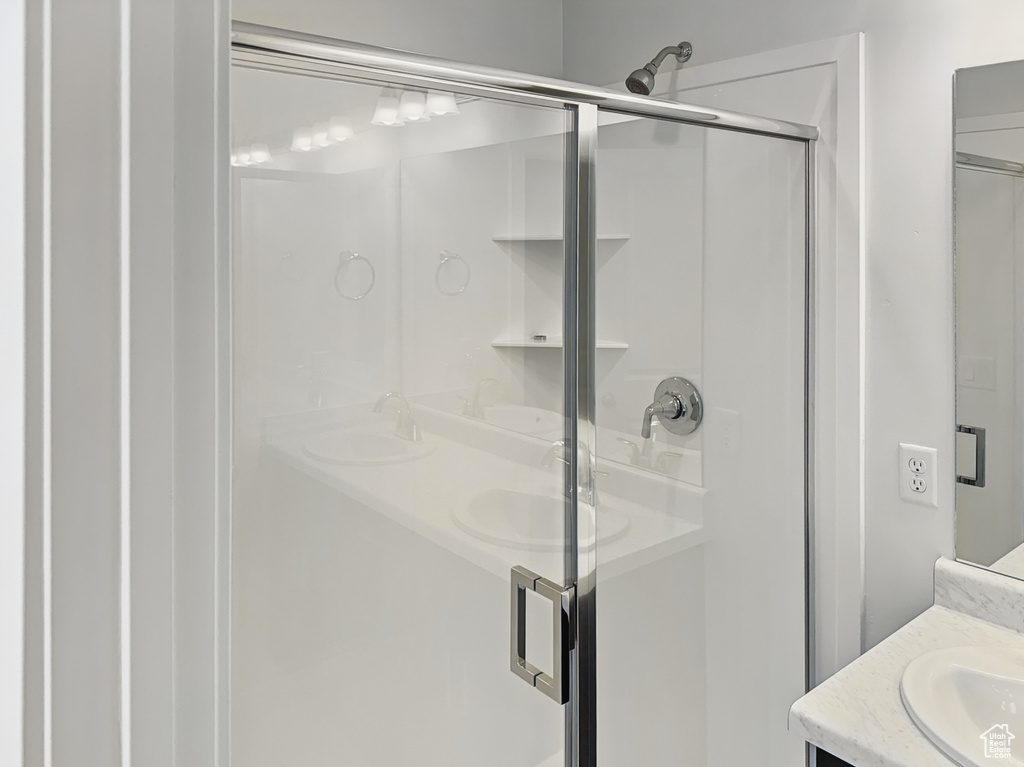 Bathroom with vanity and a shower stall