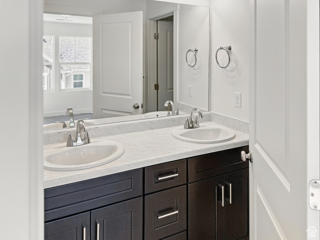 Bathroom featuring double vanity