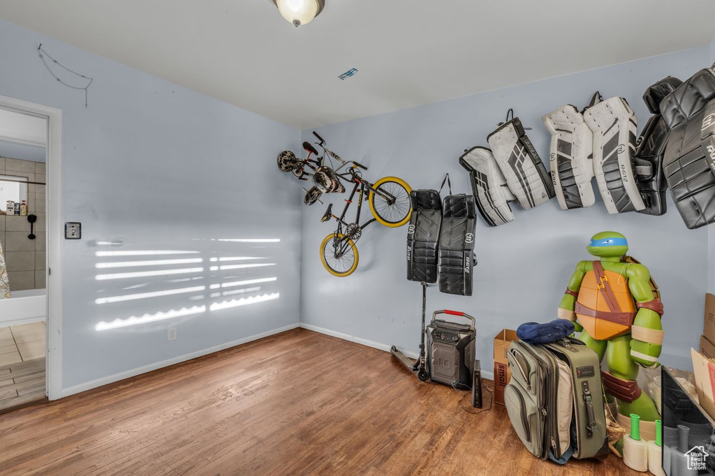 Miscellaneous room with wood finished floors and baseboards