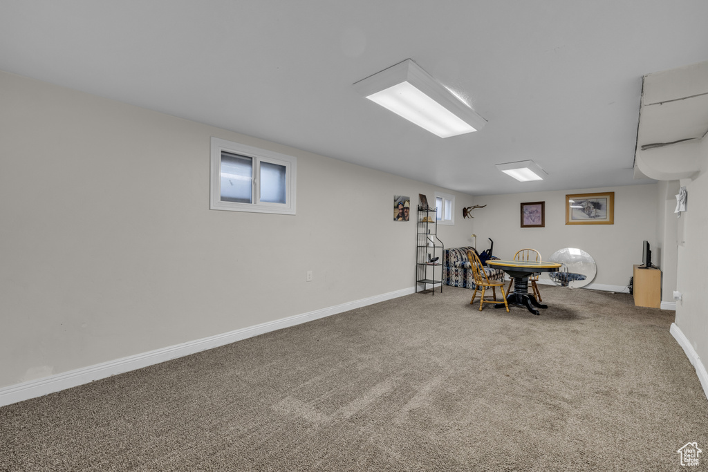 Recreation room featuring carpet and baseboards