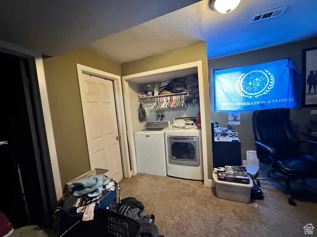 Laundry room with independent washer and dryer and carpet flooring