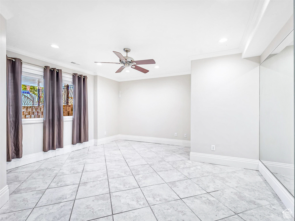 Unfurnished room featuring a ceiling fan, recessed lighting, crown molding, and baseboards