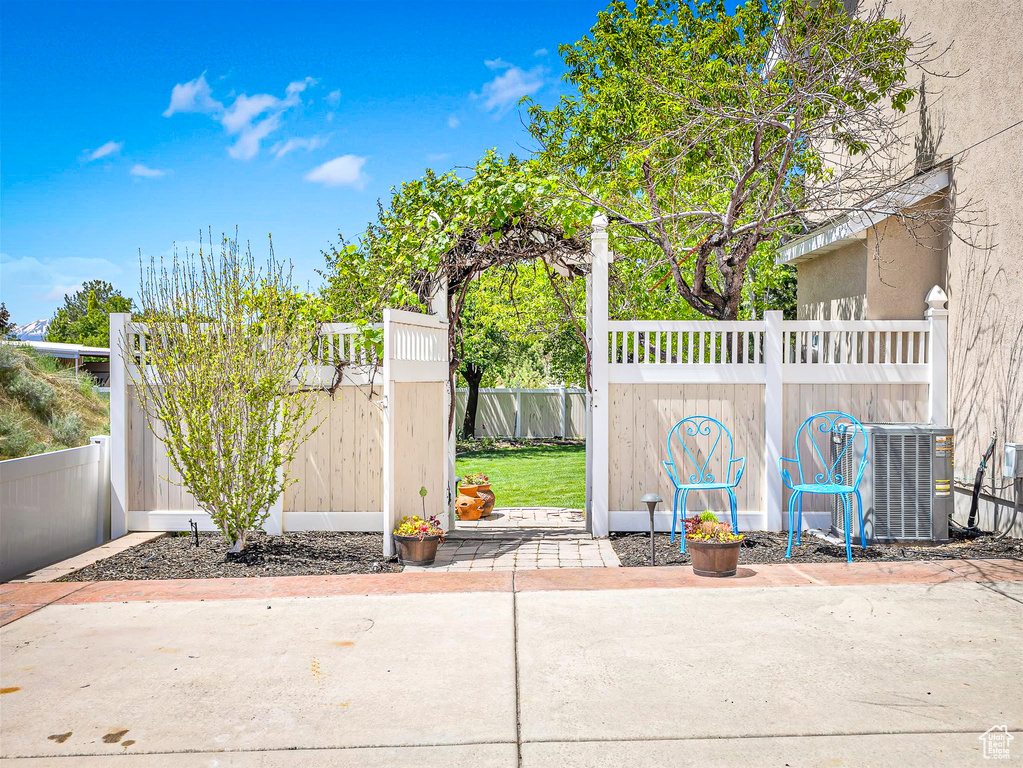 View of patio featuring cooling unit