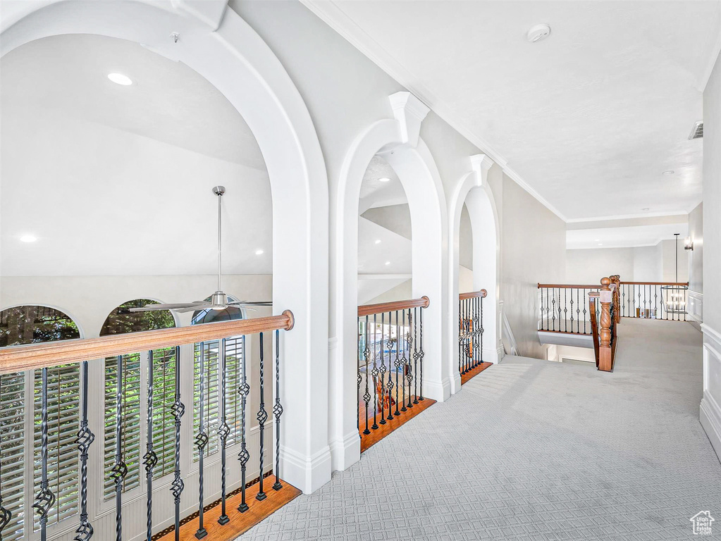 Hallway featuring carpet floors, an upstairs landing, baseboards, and recessed lighting