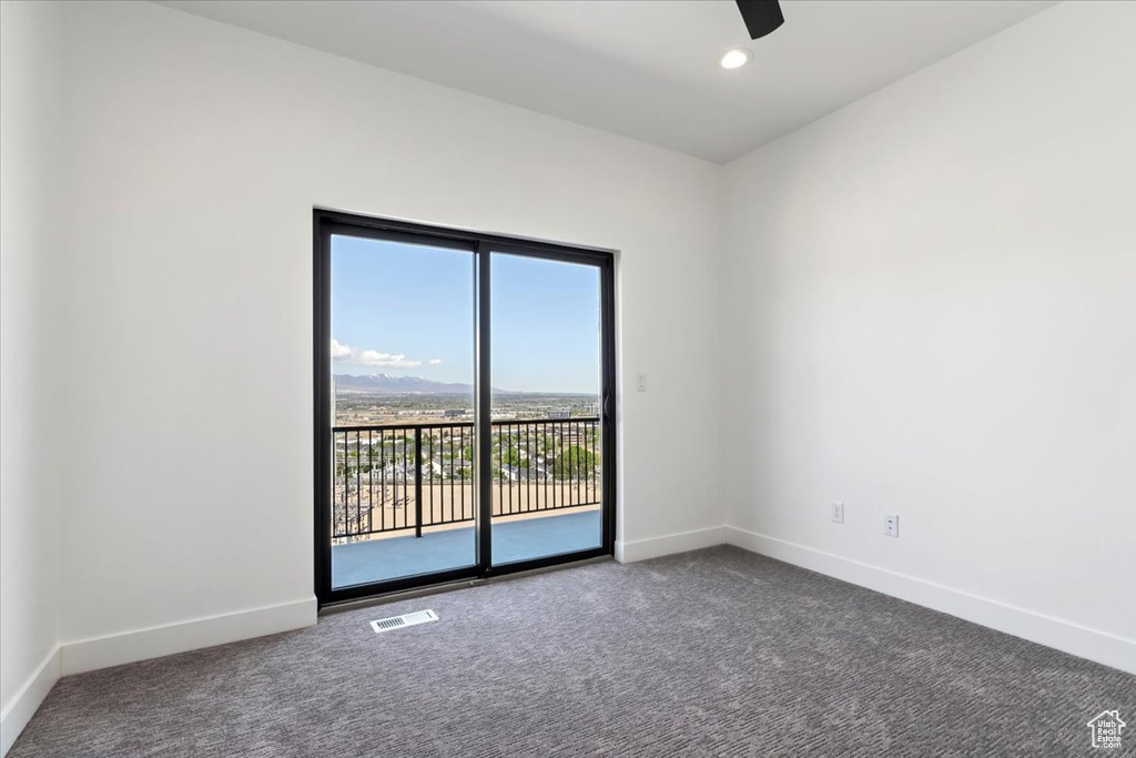 Carpeted empty room with baseboards, a ceiling fan, and recessed lighting