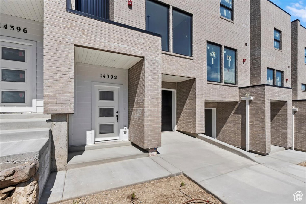 Property entrance with brick siding