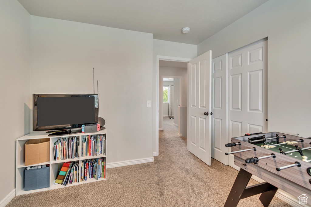 Playroom with carpet flooring and baseboards