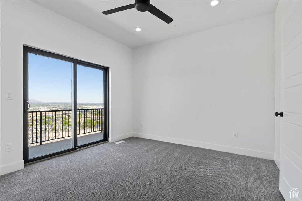 Unfurnished room with carpet floors, baseboards, recessed lighting, and a ceiling fan