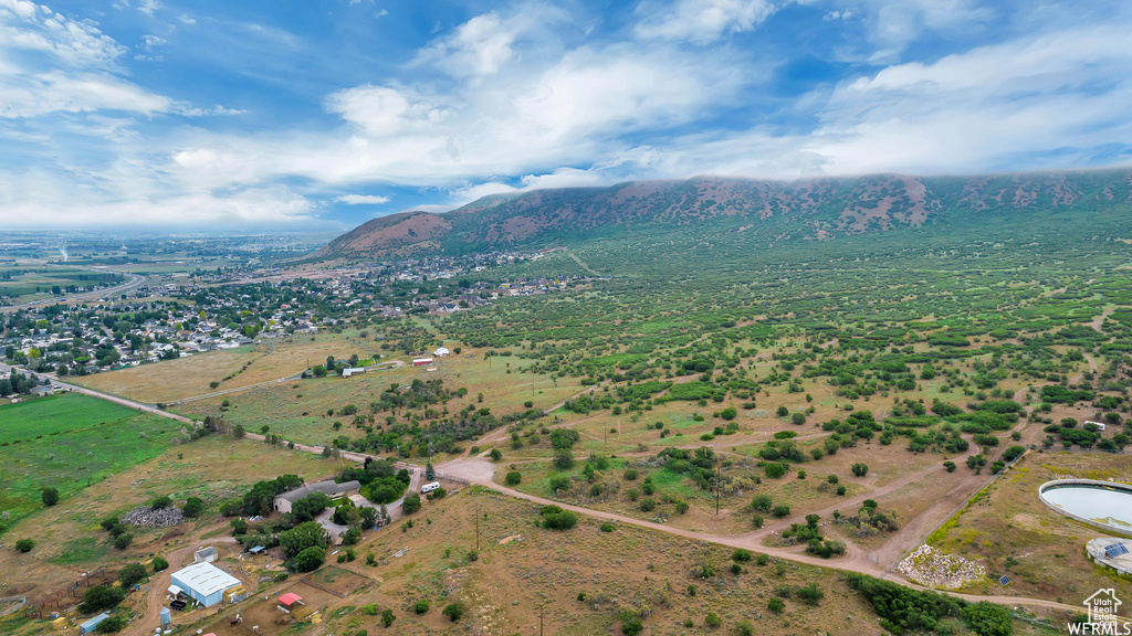 Aerial overview of property\'s location with mountains and rural landscape