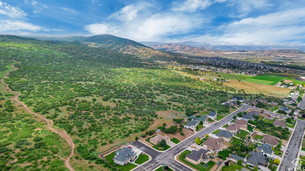 Aerial view of property\'s location featuring a mountain backdrop
