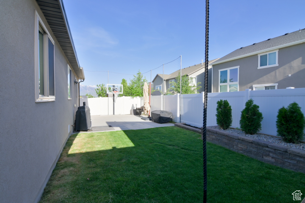 View of yard featuring a patio area and a residential view