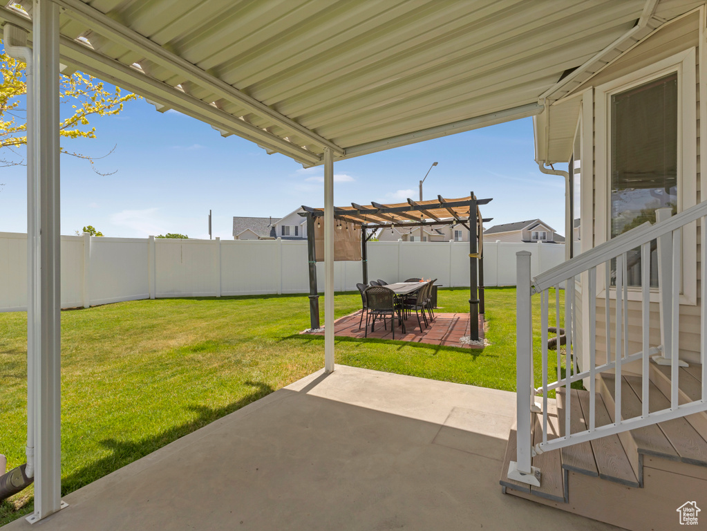 View of patio featuring a pergola and outdoor dining space