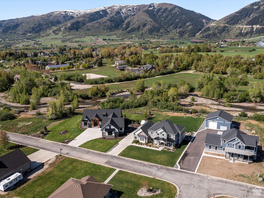 Aerial perspective of suburban area with a mountain backdrop