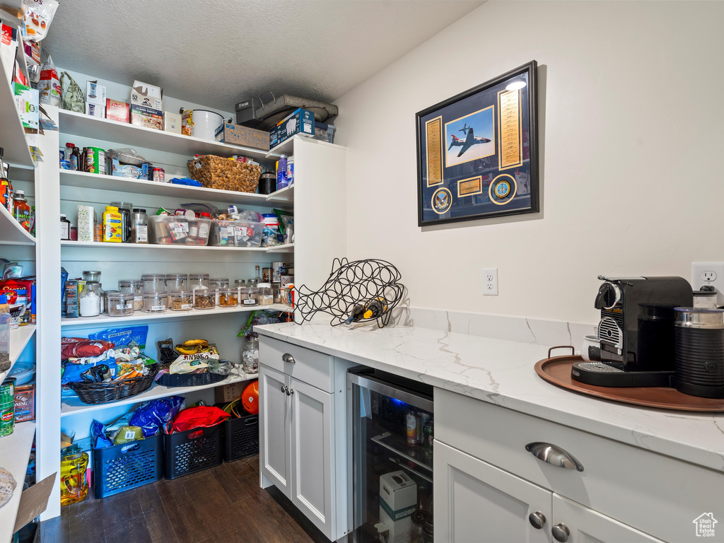 Pantry featuring wine cooler