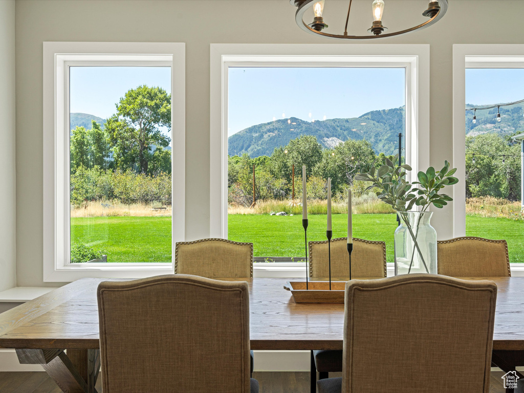 Dining space with a mountain view and a chandelier