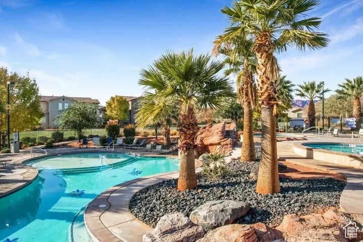 Community pool with a patio